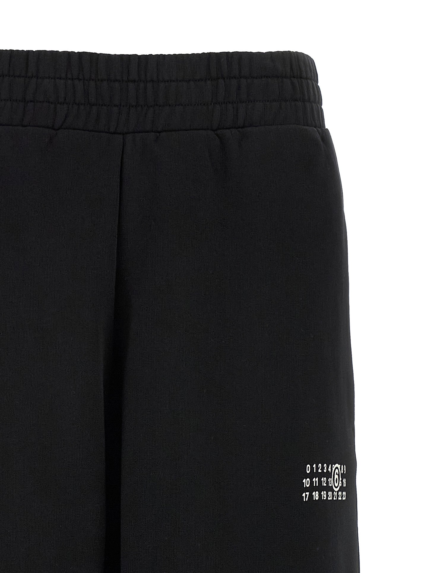 Joggers by MM6 Maison Margiela for women in cotton black, white, signature & print features an refined tailoring silhouette, showcasing a premium wide with a high rise and long cut for a refined tailoring look.