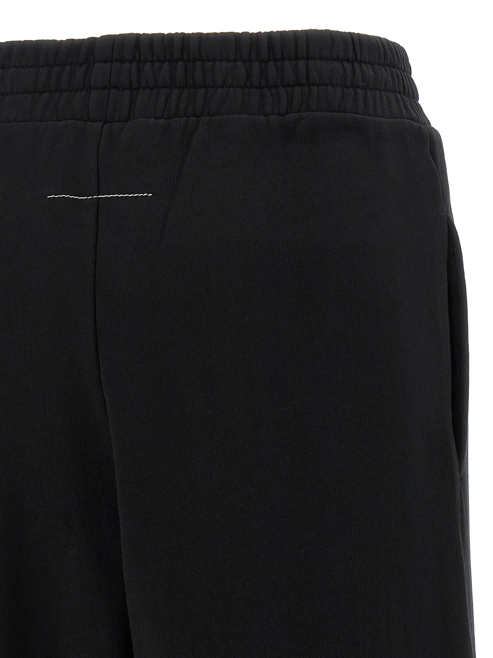 Joggers by MM6 Maison Margiela for women in cotton black, white, signature & print features an sartorial wide and long with a high rise cut for a sartorial finish.