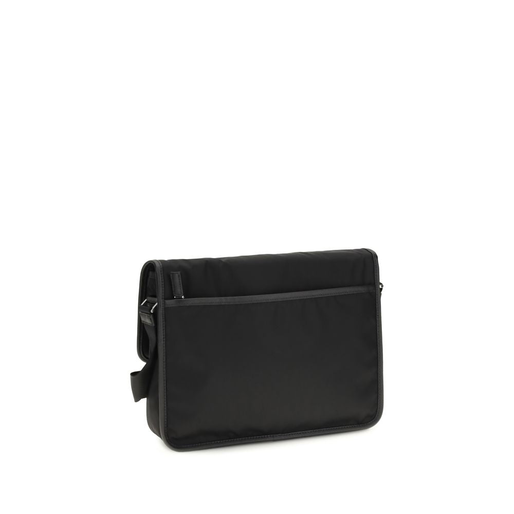 Shoulder Flap Bag by Prada for men in polyamide polyester nylon leather & viscose black & signature features a distinguished silhouette, showcasing a secure snap, flap & zipper and distinguished with versatile shoulder-strap & adjustable-strap for a distinguished finish.