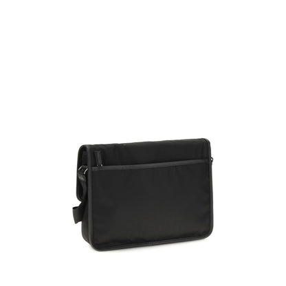 Shoulder Flap Bag by Prada for men in polyamide polyester nylon leather & viscose black & signature features a distinguished silhouette, showcasing a secure snap, flap & zipper and distinguished with versatile shoulder-strap & adjustable-strap for a distinguished finish.
