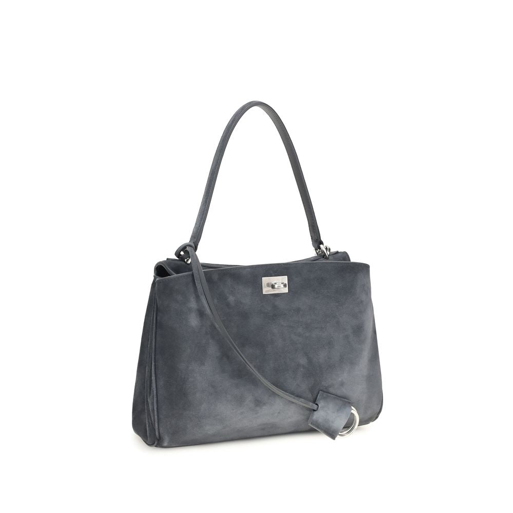 This Handbag by Balenciaga for women in bio-acetate & bos taurus suede calfskin leather and gray & silver presents a sculptural silhouette featuring a secure , ample built-in-compartments & external-pockets, and versatile shoulder-strap & handle for a sculptural finish.