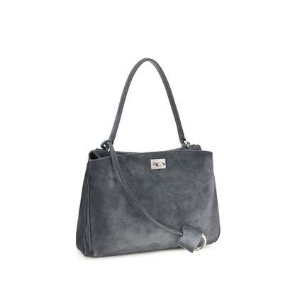 This Handbag by Balenciaga for women in bio-acetate & bos taurus suede calfskin leather and gray & silver presents a sculptural silhouette featuring a secure , ample built-in-compartments & external-pockets, and versatile shoulder-strap & handle for a sculptural finish.