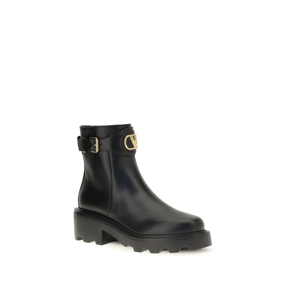 Ankle Strap Boots by Valentino Garavani for women in bos taurus calfskin leather black & signature features an dynamic silhouette, showcasing the dynamic V Logo Women's Bos Taurus Calfskin Leather Ankle Strap Boots design with its distinctive and elegant .