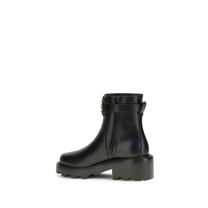 Ankle Strap Boots by Valentino Garavani for women in bos taurus calfskin leather black & signature features an avant-garde V Logo Women's Bos Taurus Calfskin Leather Ankle Strap Boots silhouette, defined by a sophisticated and a avant-garde .