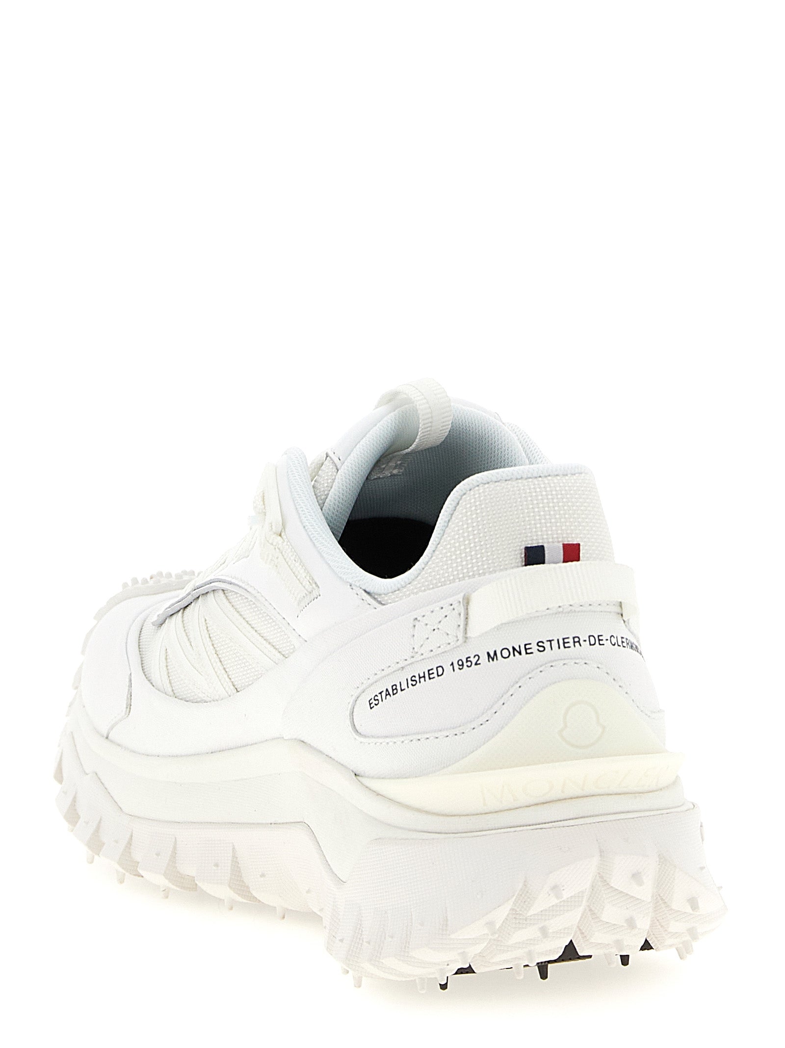 Athletic Sneakers by Moncler for women in white showcases a architectural silhouette, artfully capturing the essence of the Women's Athletic EVA & Polyamide Sneakers with its signature architectural athletic style construction.