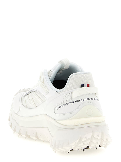 Athletic Sneakers by Moncler for women in white showcases a architectural silhouette, artfully capturing the essence of the Women's Athletic EVA & Polyamide Sneakers with its signature architectural athletic style construction.