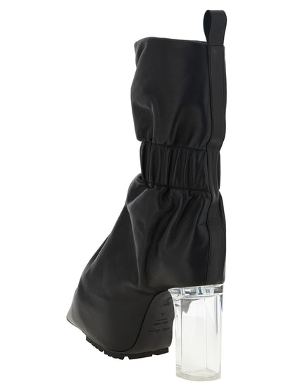 Ankle Boots by Rick Owens for women in bos taurus calfskin leather & plexiglass black & natural features an enchanting design from the Women's Bos Taurus Calfskin Leather & Plexiglass Ankle Boots collection, highlighting a enchanting and pointed toe style for a refined look.