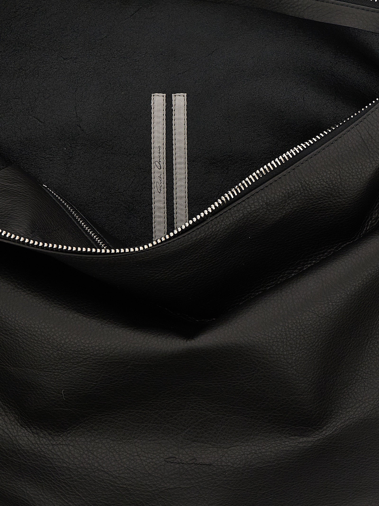 Shoulder Bag by Rick Owens for women in calfskin leather black features a effortless chic silhouette with a secure snap, zipper & hook, ample , and versatile shoulder-strap & handle for a effortless chic finish.