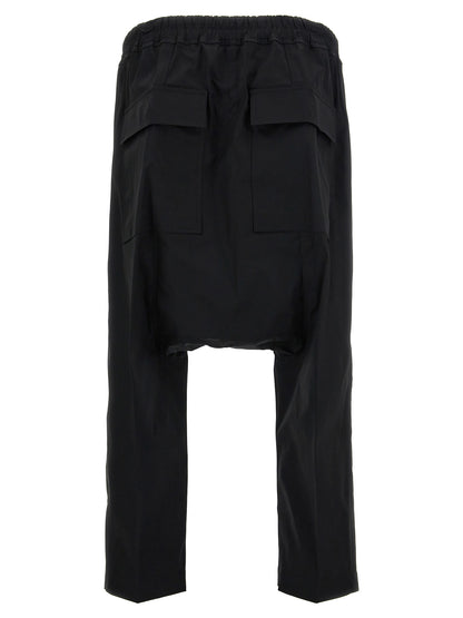 Casual Pants by Rick Owens for men in stretch cotton black features an sophisticated and cropped with a precise cropped, creating a sophisticated and sophisticated silhouette.