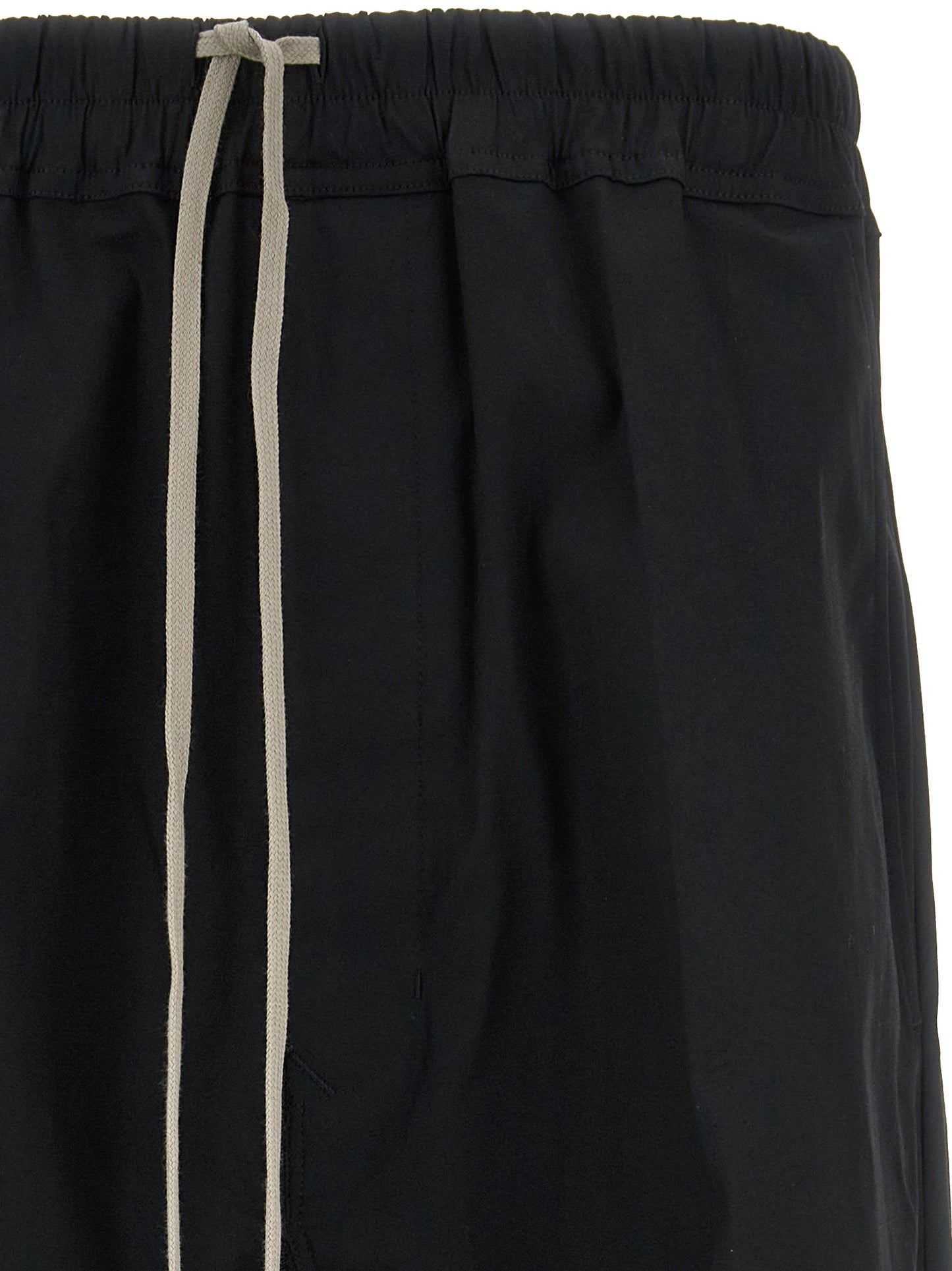 Casual Pants by Rick Owens for men in stretch cotton black features a polished silhouette with a polished cropped, reaching a polished cropped and finished with a polished .