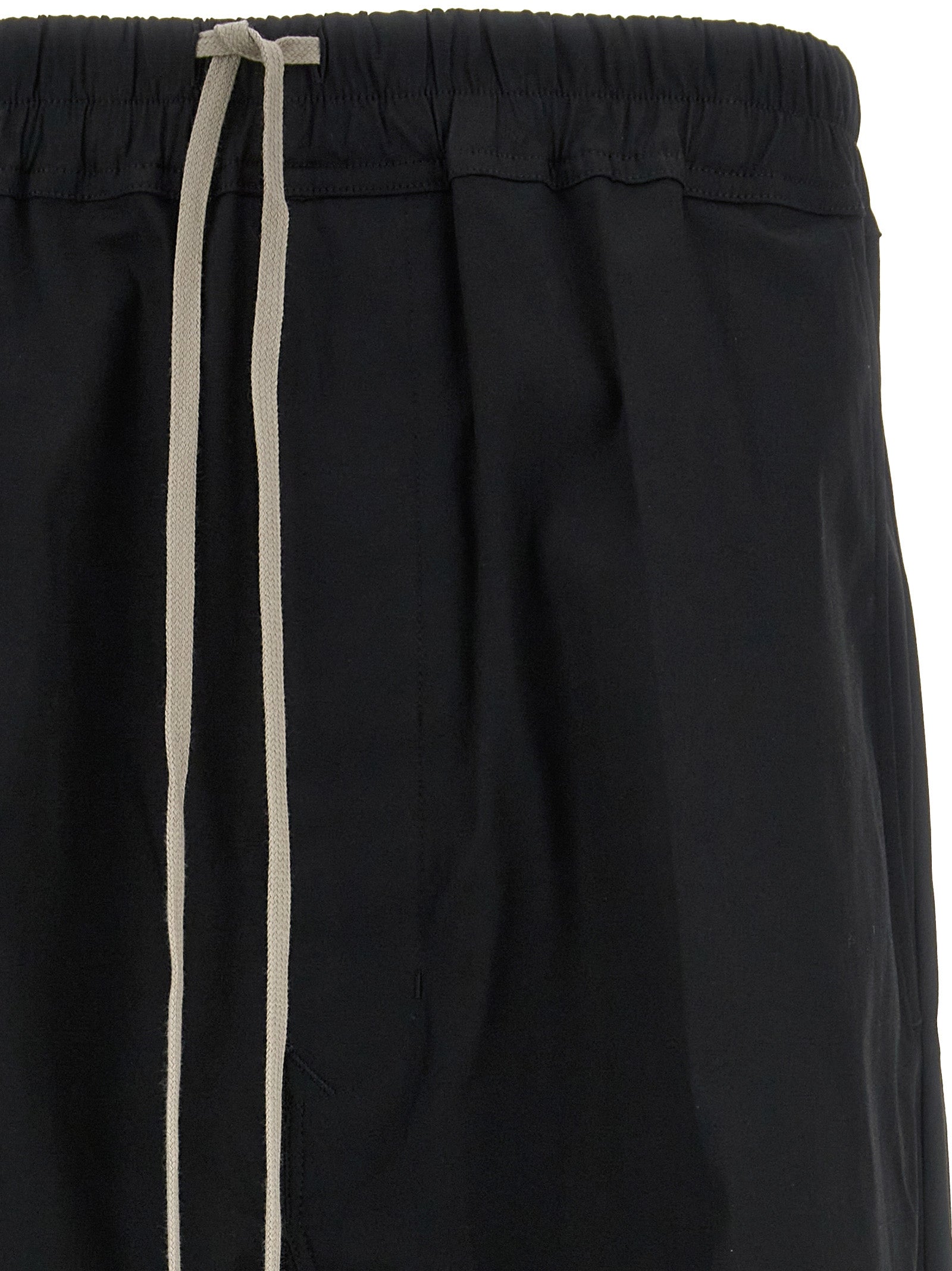 Casual Pants by Rick Owens for men in stretch cotton black features a polished silhouette with a polished cropped, reaching a polished cropped and finished with a polished .