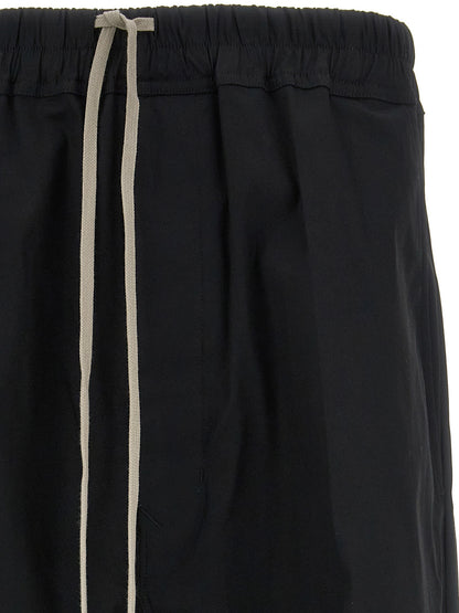 Casual Pants by Rick Owens for men in stretch cotton black features a polished silhouette with a polished cropped, reaching a polished cropped and finished with a polished .