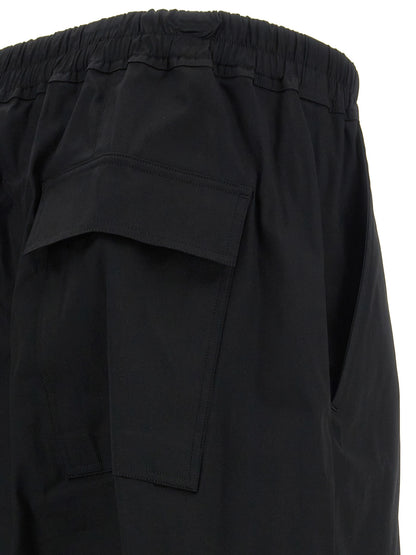 Casual Pants by Rick Owens for men in stretch cotton black features an sartorial cropped and cropped with a cut for a sartorial finish.