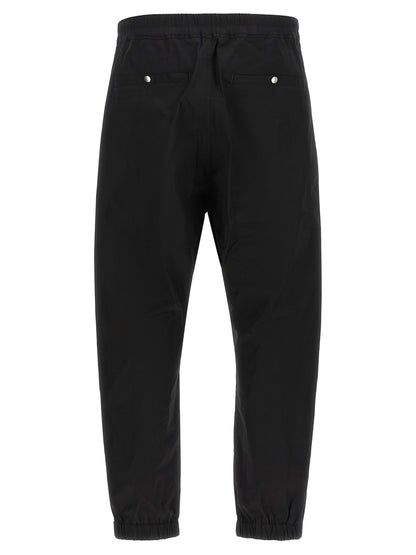 Joggers by Rick Owens for men in cotton black features a polished silhouette with a polished , reaching a polished long and finished with a polished .