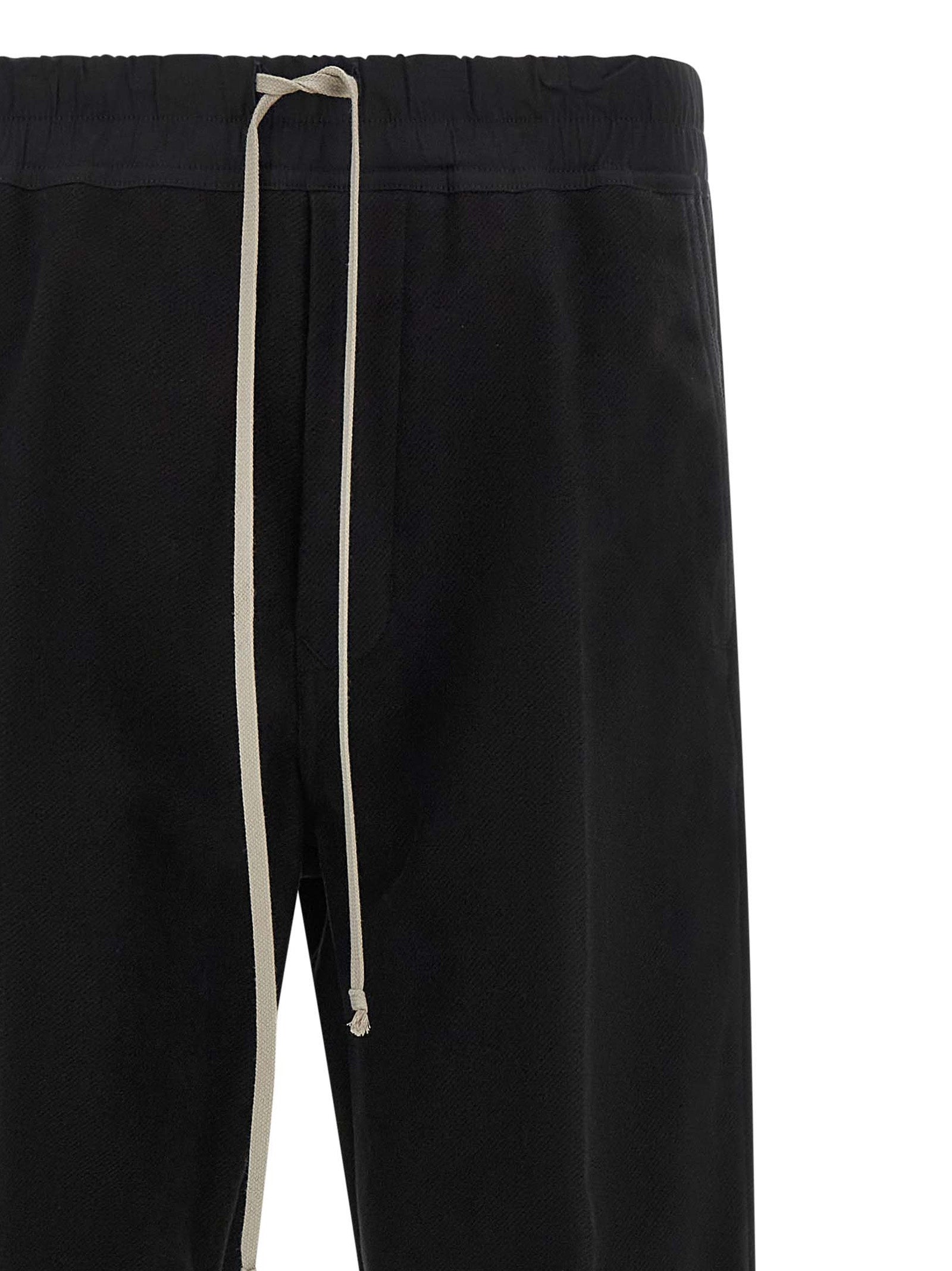 Trousers by Rick Owens for men in cotton black & herringbone presents a smart silhouette, meticulously detailed with a smart straight-leg & wide, a smart long, and a smart .