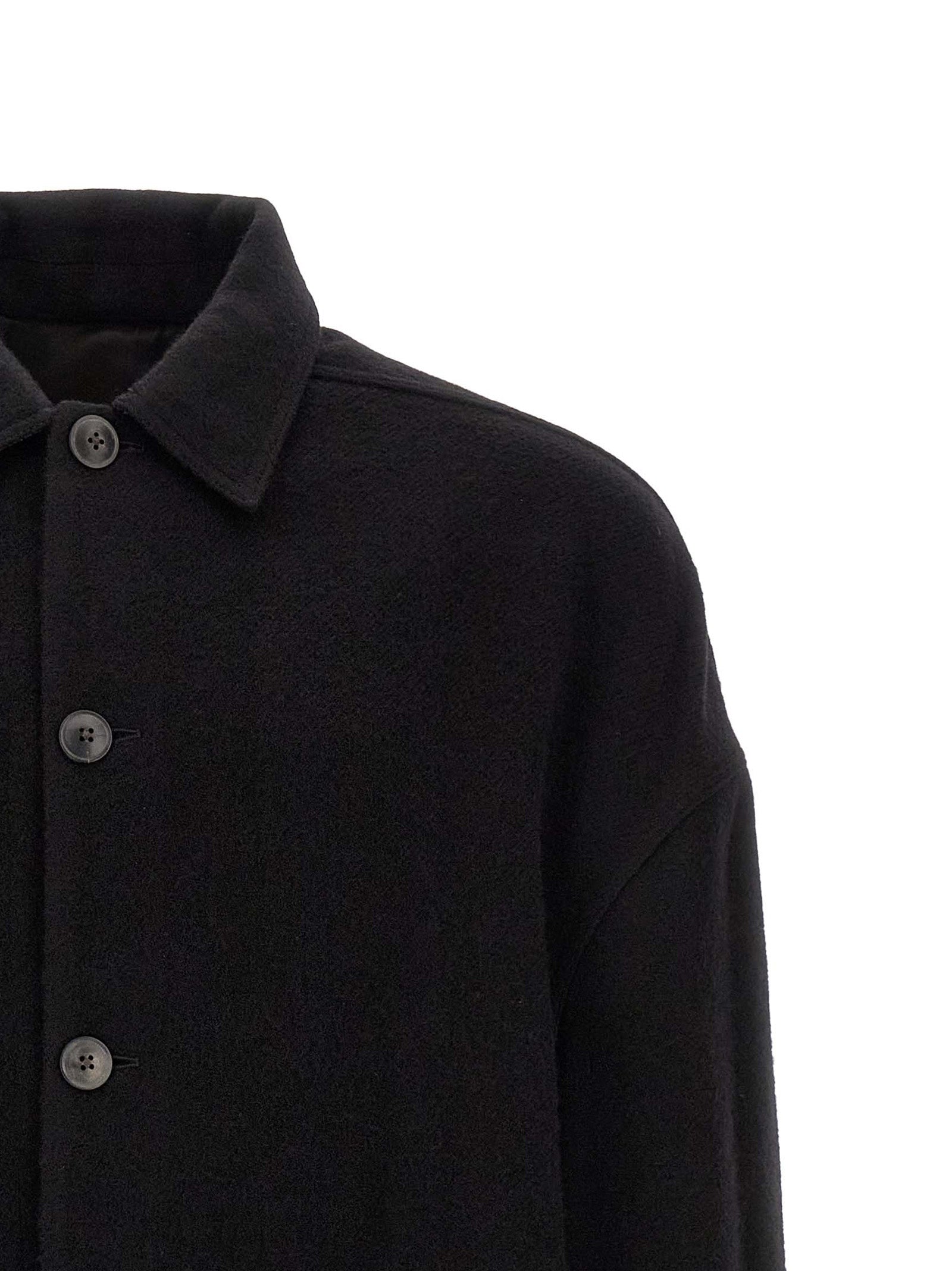 Overcoat by Rick Owens for men in virgin wool black features an satoral silhouette, showcasing a sophisticated split shirt-collar neckline and satoral pockets for a premium, timeless look.