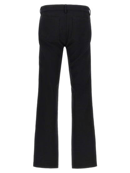 Pants by Rick Owens for men in virgin wool black & herringbone features an understated silhouette, showcasing a sophisticated straight-leg and long with a refined low rise for an understated, polished aesthetic.
