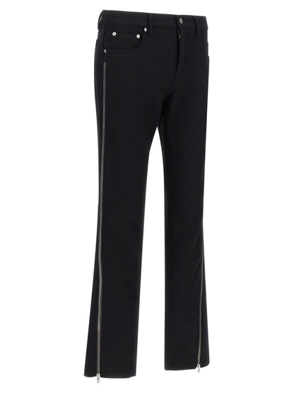 Pants by Rick Owens for men in virgin wool black & herringbone features a sleek silhouette with a sleek straight-leg, a refined long, and a sophisticated low rise finish.