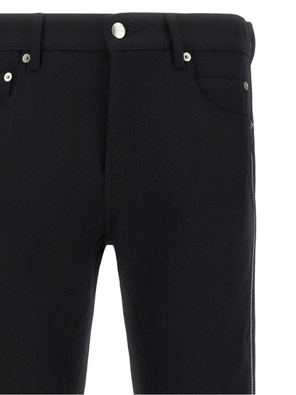 Pants by Rick Owens for men in virgin wool black & herringbone features an on trend silhouette with a low rise and straight-leg cut in an elegant long for a sophisticated look.