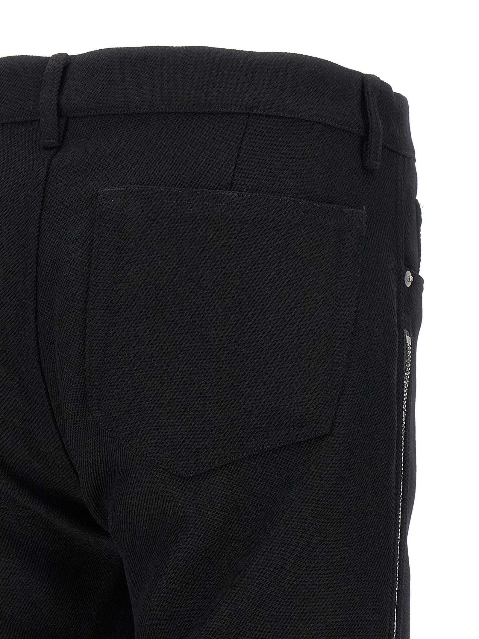 Pants by Rick Owens for men in virgin wool black & herringbone features a stylish silhouette with a stylish straight-leg, long, and low rise.