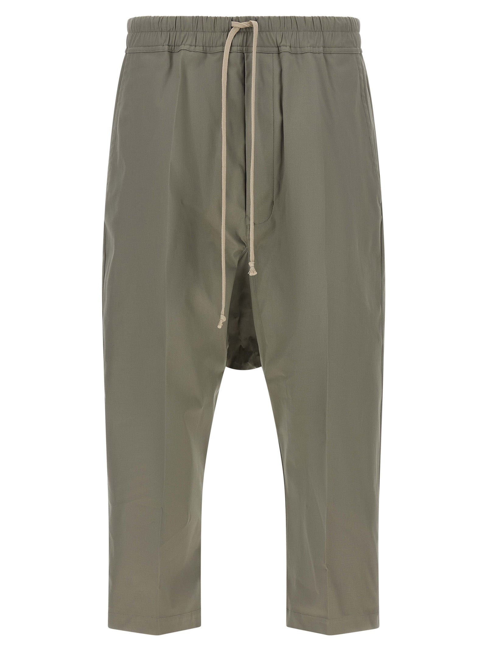 Trousers by Rick Owens for men in organic cotton gray presents a smart silhouette, meticulously detailed with a smart cropped, a smart cropped, and a smart .
