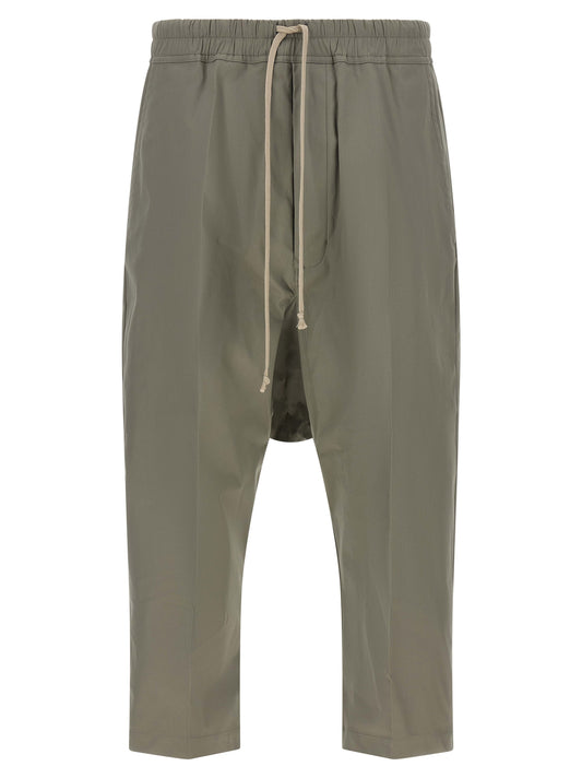 Trousers by Rick Owens for men in organic cotton gray presents a smart silhouette, meticulously detailed with a smart cropped, a smart cropped, and a smart .