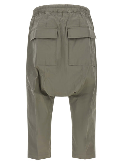 Trousers by Rick Owens for men in organic cotton gray features an sartorial silhouette, showcasing a precise cropped and cropped with a sartorial for a refined look.