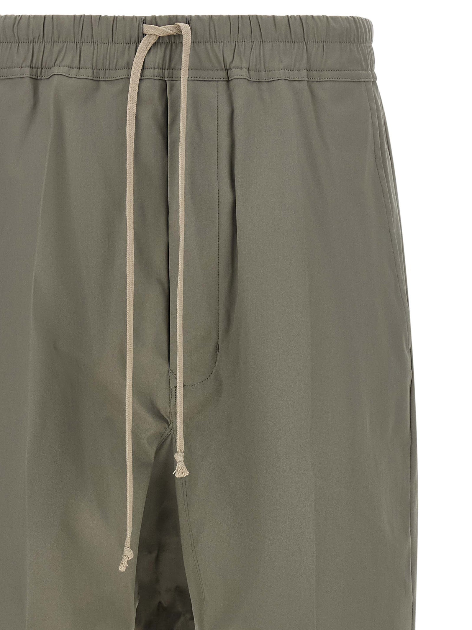 Trousers by Rick Owens for men in organic cotton gray features a tailored silhouette with a tailored cropped, defined by its cropped and a sophisticated .
