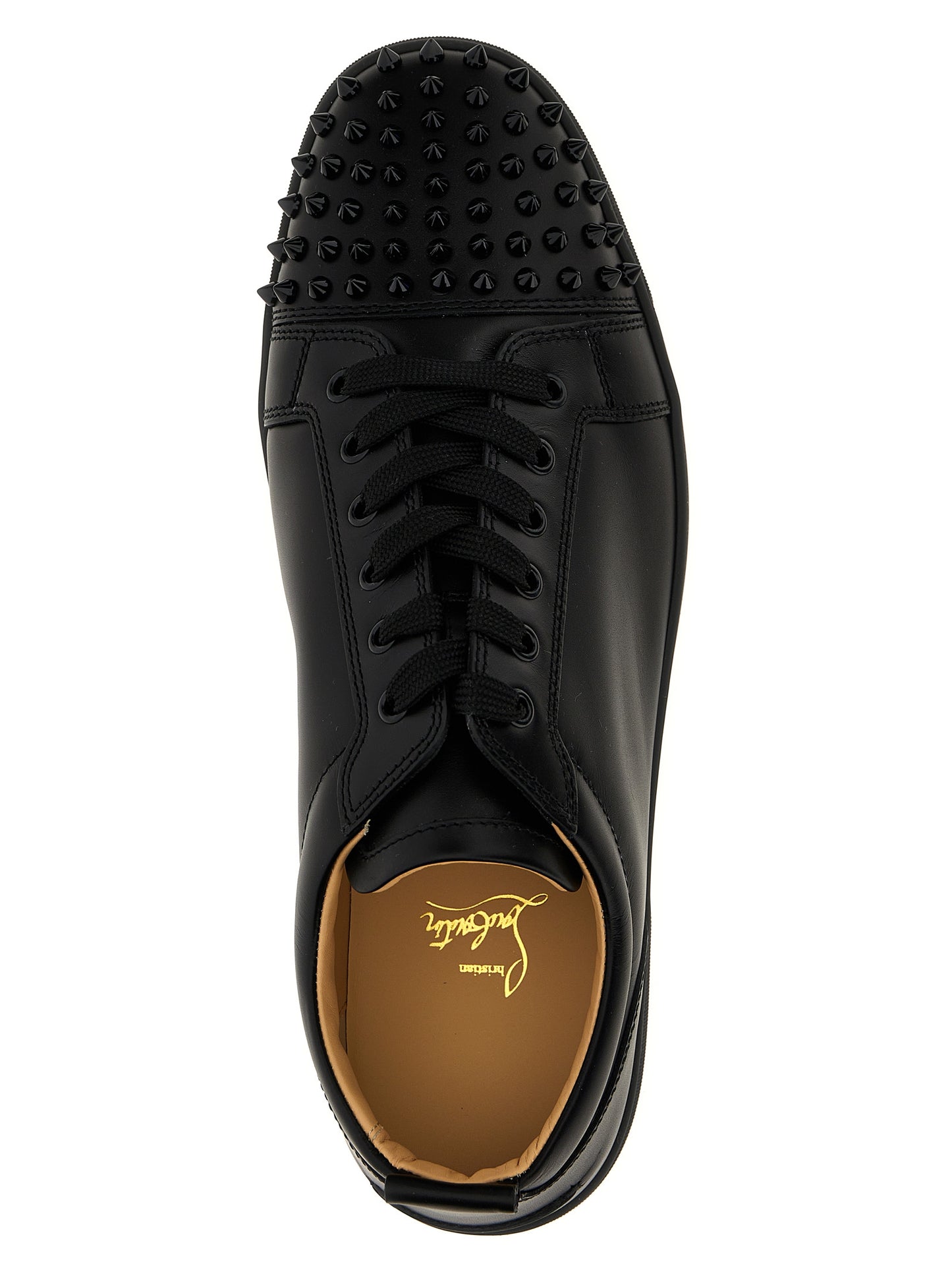 Sneakers by Christian Louboutin for men in calfskin leather black presents a sumptuous silhouette, artfully capturing the essence of the Louis Men's Low Top Calfskin Leather Sneakers with its sumptuous low-top style design.