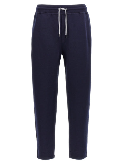 Joggers by Brunello Cucinelli for men in silk cotton & cashmere blue features a polished silhouette with a polished , reaching a polished long and finished with a polished .