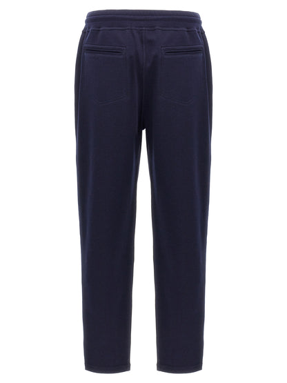 Joggers by Brunello Cucinelli for men in silk cotton & cashmere blue presents a refined pantology silhouette, artfully defined by a refined pantology , long, and a sophisticated .