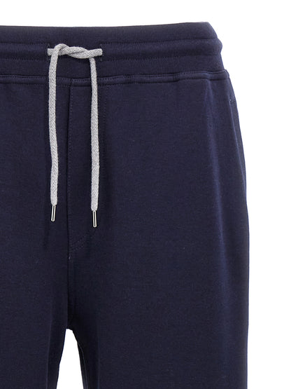 Joggers by Brunello Cucinelli for men in silk cotton & cashmere blue presents a tailored silhouette, showcasing a tailored and long cut with a refined for a truly tailored aesthetic.