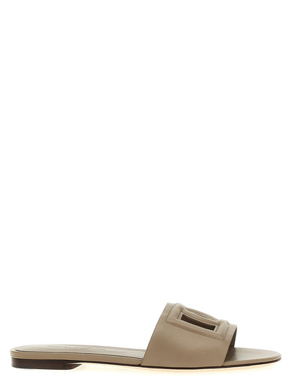Sliders Flat Shoes by Dolce & Gabbana for women in calfskin leather gray features an statuesque silhouette from the Women's Calfskin Leather Sliders Flat Shoes collection, showcasing a and a statuesque for a statuesque look.