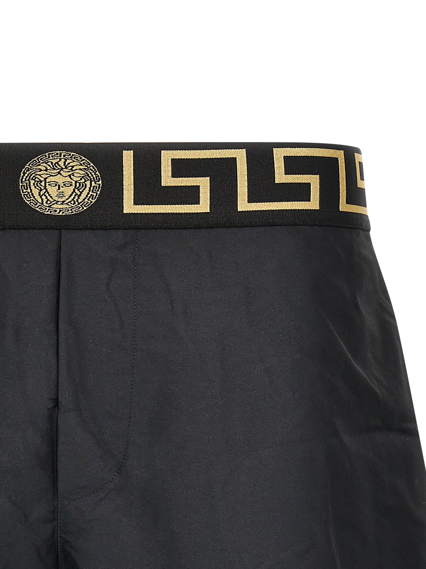 Swim Shorts by Versace for men in nylon polyester & mesh multicolor showcases a contemporary silhouette, artfully capturing the essence of the contemporary Waves Men's Nylon Polyester & Mesh Swim Shorts design for a sophisticated look.
