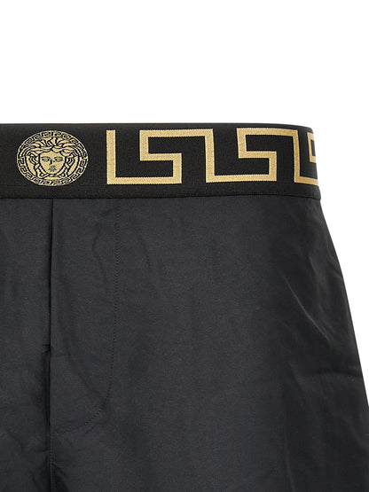 Swim Shorts by Versace for men in nylon polyester & mesh multicolor showcases a contemporary silhouette, artfully capturing the essence of the contemporary Waves Men's Nylon Polyester & Mesh Swim Shorts design for a sophisticated look.