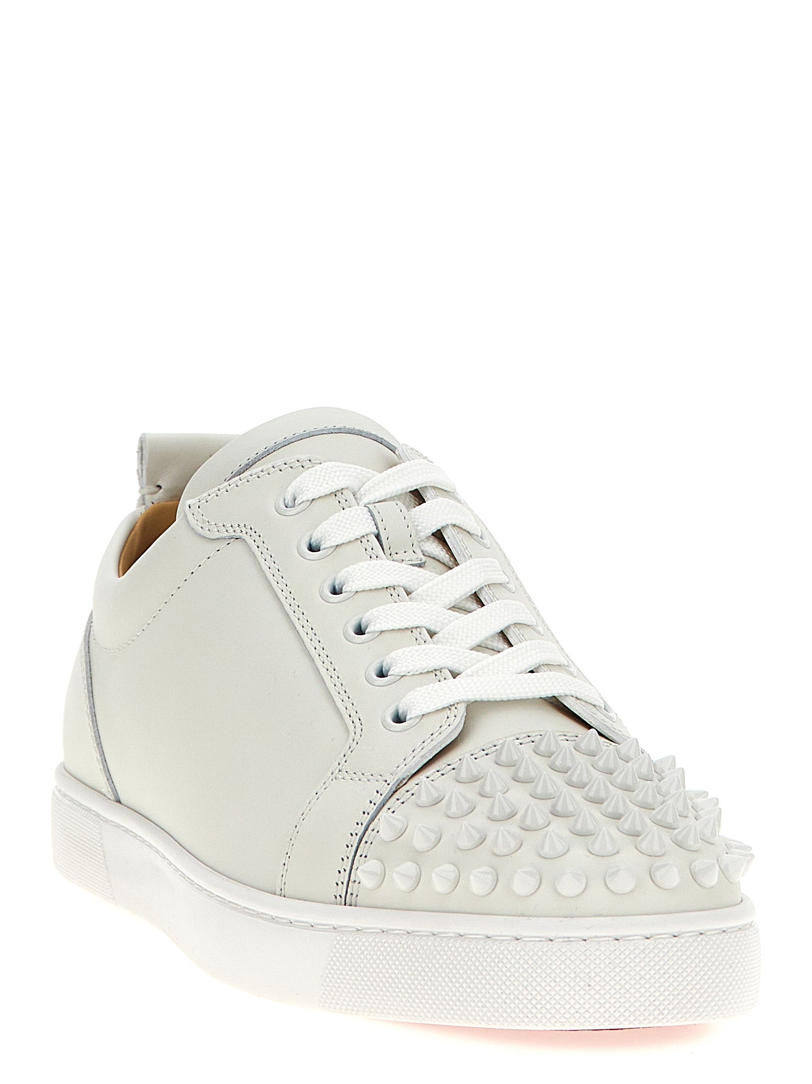 Sneakers by Christian Louboutin for men in calfskin leather white features an timeless silhouette from the Louis Men's Low Top Calfskin Leather Sneakers collection, showcasing a signature low-top style with an timeless finish.
