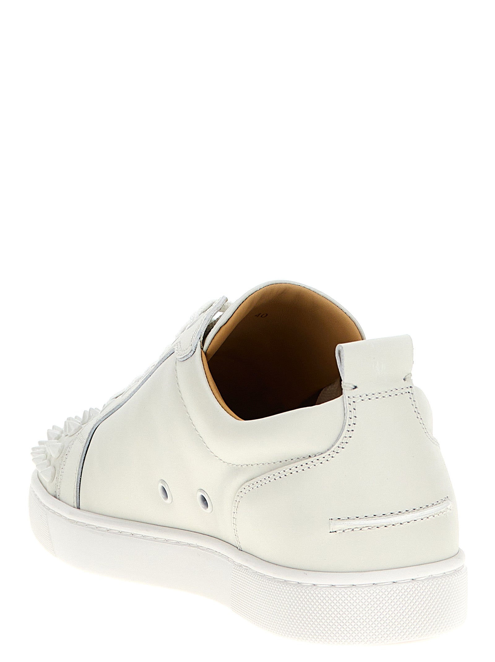 Sneakers by Christian Louboutin for men in calfskin leather white presents a on trend silhouette from the Louis Men's Low Top Calfskin Leather Sneakers collection, showcasing a on trend low-top style for an elevated aesthetic.