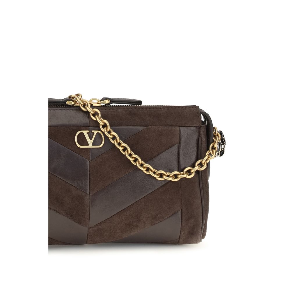 Shoulder Bag by Valentino Garavani for women in bio-acetate enamel & bos taurus calf leather brown, gold, patterned, chevron & signature presents a versatile silhouette, showcasing a secure zipper and versatile single-compartment with versatile shoulder-strap & adjustable-strap for a sophisticated look.