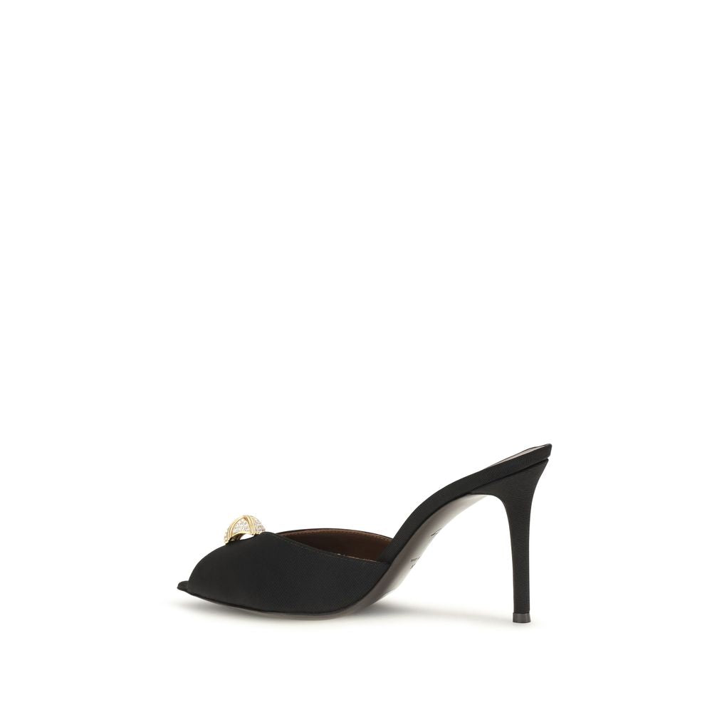Stiletto Mules Sandals by Giuseppe Zanotti for women in black & gold presents a sculptural silhouette, showcasing the Women's Bos Taurus Calf Leather & Rhinestone Stiletto Mules Sandals design with a sculptural stiletto and pointed toe style for a premium look.