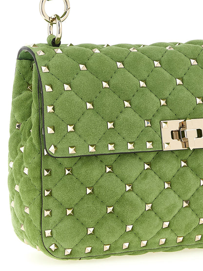 Medium Quilted Shoulder Flap Bag by Valentino Garavani for women in nappa & suede calfskin leather bicolour & green features a effortless chic silhouette with a secure flap, ample , and versatile shoulder-strap, handle & detachable-strap for a effortless chic finish.