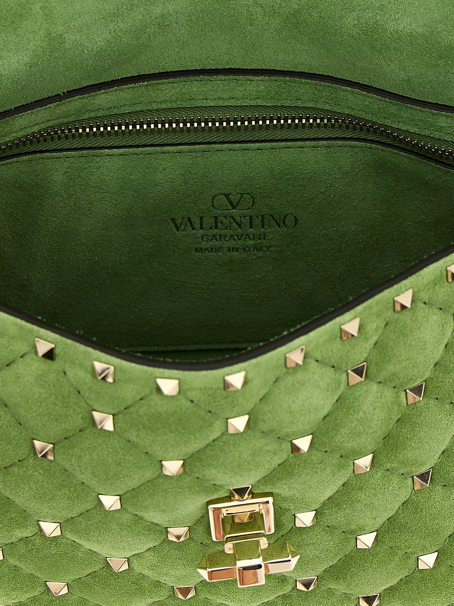 Medium Quilted Shoulder Flap Bag by Valentino Garavani for women in nappa & suede calfskin leather bicolour & green features a distinguished silhouette, showcasing a secure flap and distinguished with versatile shoulder-strap, handle & detachable-strap for a distinguished finish.