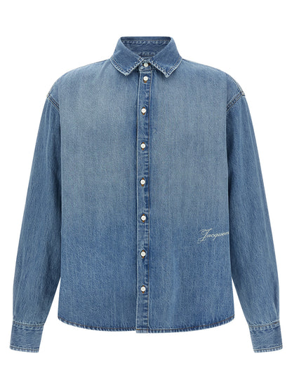 Shirt by Jacquemus for men in denim cotton blue showcases a sharp silhouette, elegantly detailed with a sharp and sharp long-sleeve.