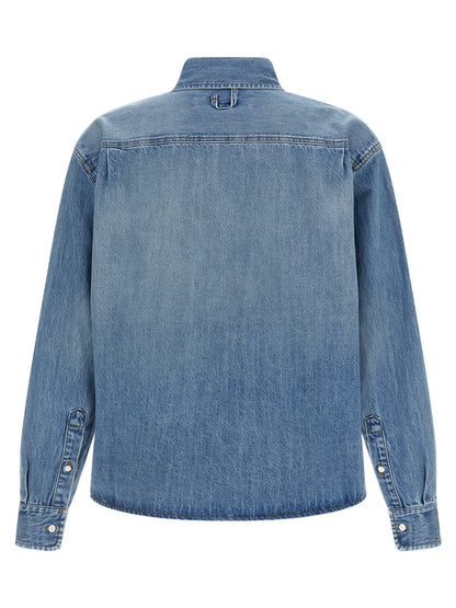 Shirt by Jacquemus for men in denim cotton blue showcases a sleek silhouette, elegantly detailed with a sleek and for a sleek finish.
