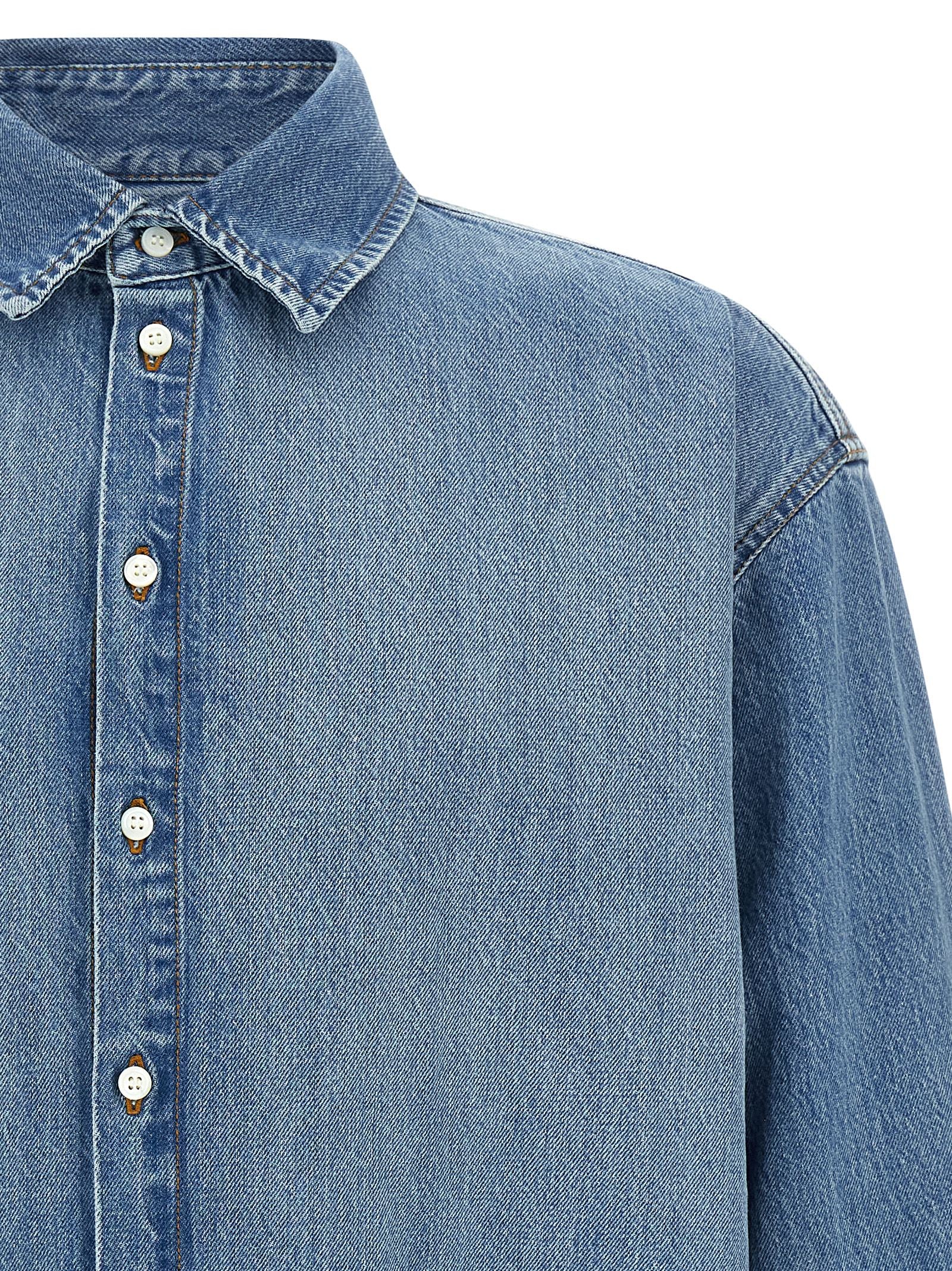 Shirt by Jacquemus for men in denim cotton blue features an architectural silhouette with a refined and elegant for a architectural look.
