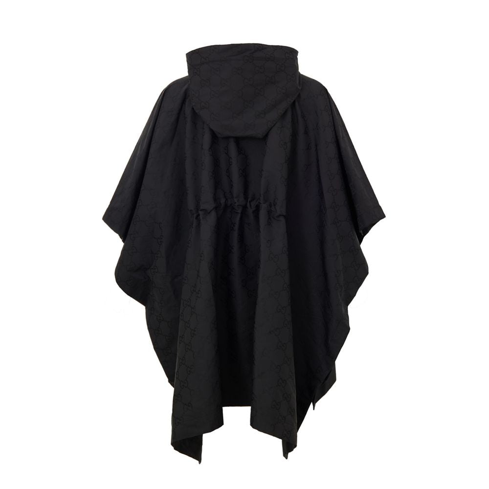 Hooded Trench Coat by Gucci for men in polyamide & polyester black, monogram & print presents an sculptural silhouette, artfully detailed with a sculptural hooded neckline and functional hooded for a truly sculptural finish.