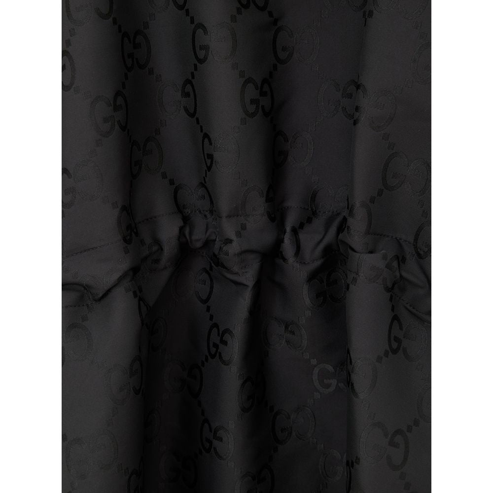 Hooded Trench Coat by Gucci for men in polyamide & polyester black, monogram & print presents a utilitarian silhouette, showcasing a utilitarian hooded neckline and sophisticated hooded for a truly utilitarian look.