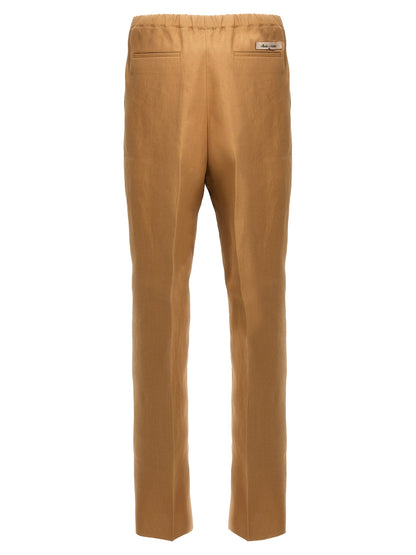 Trousers by Fendi for men in canvas beige presents a perennial silhouette, meticulously tailored with a cut, long finish, and an elegant .