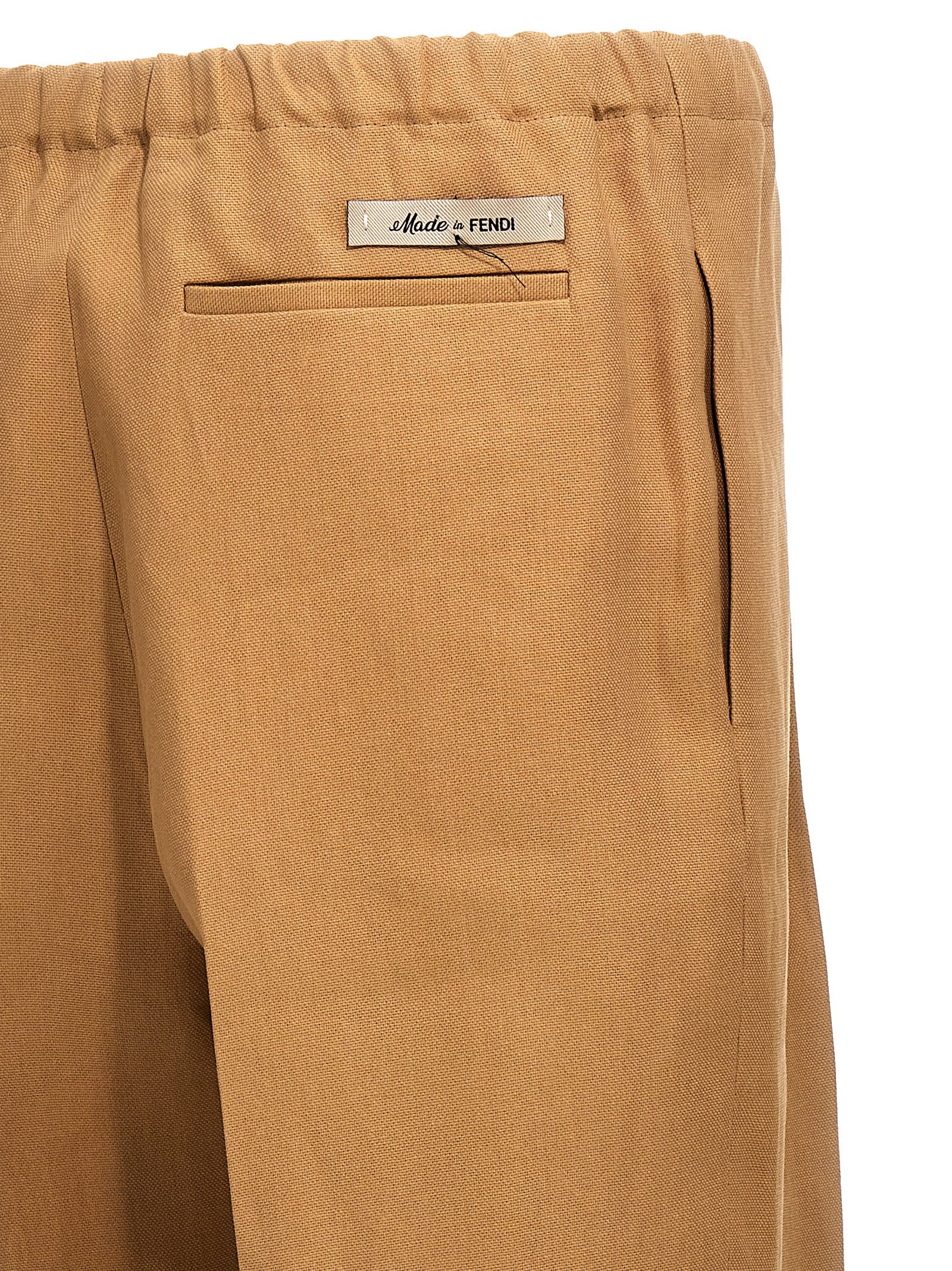 Trousers by Fendi for men in canvas beige features an sartorial silhouette, showcasing a precise and long with a sartorial for a refined look.