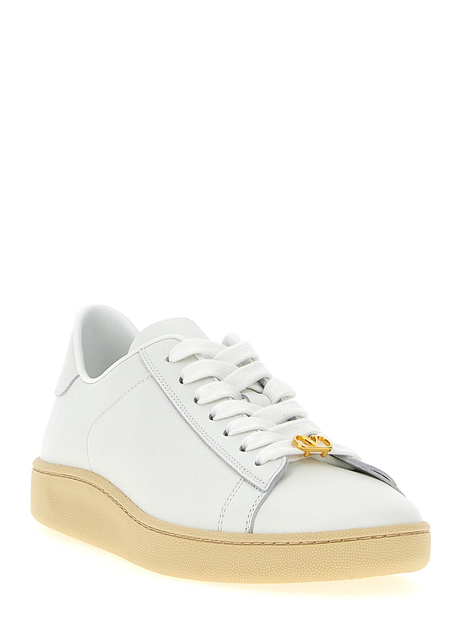 Sneakers by Valentino Garavani for men in calfskin leather white & signature presents a impeccable silhouette as V Logo Men's Low Top Calfskin Leather Sneakers, expertly defined by a impeccable low-top style for a impeccable, high-fashion look.