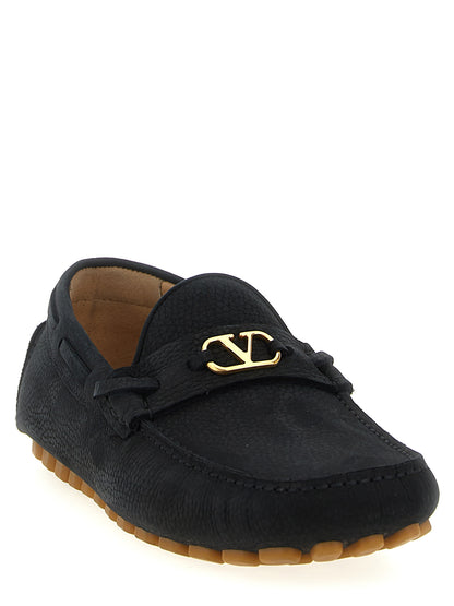 This Loafer Slip-On Shoes by Valentino Garavani for men in calfskin leather black & signature features an exquisite silhouette from the V Logo Men's Calfskin Leather Loafer Slip-On Shoes collection, defined by a sophisticated and elegant .
